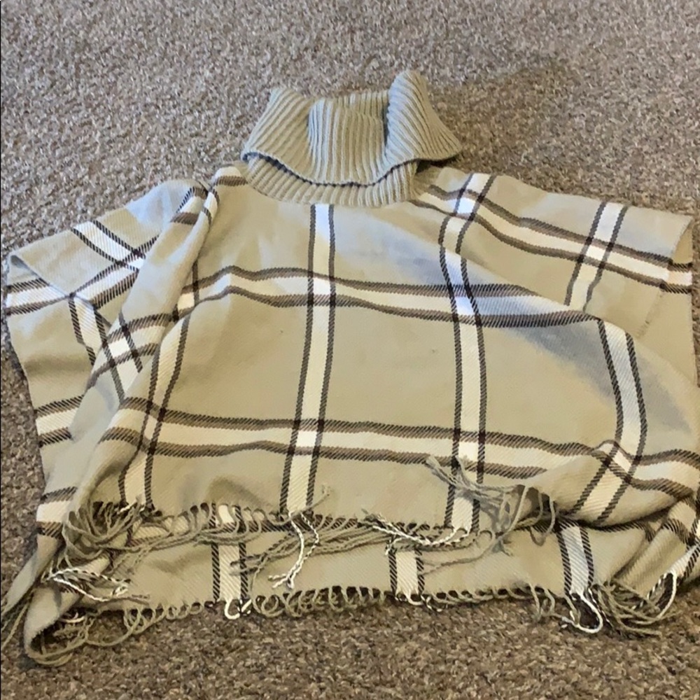 Gorgeous poncho is neutral tones